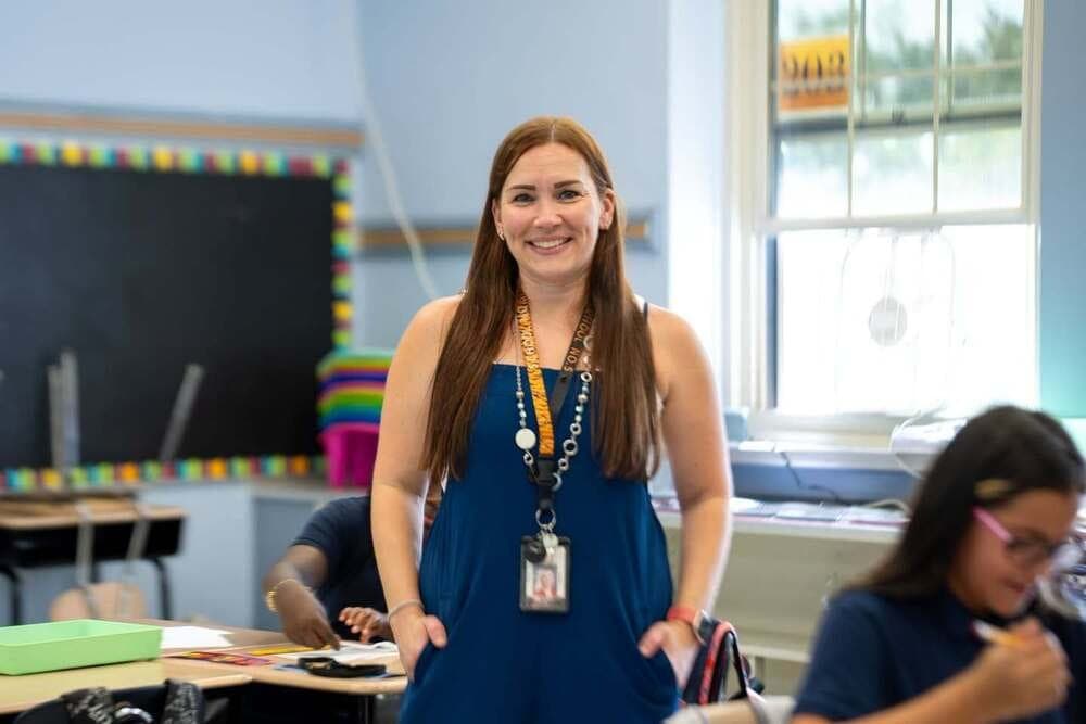 Kara-Lynne Frees-Spoganetz works with students in her School No. 5 classroom.