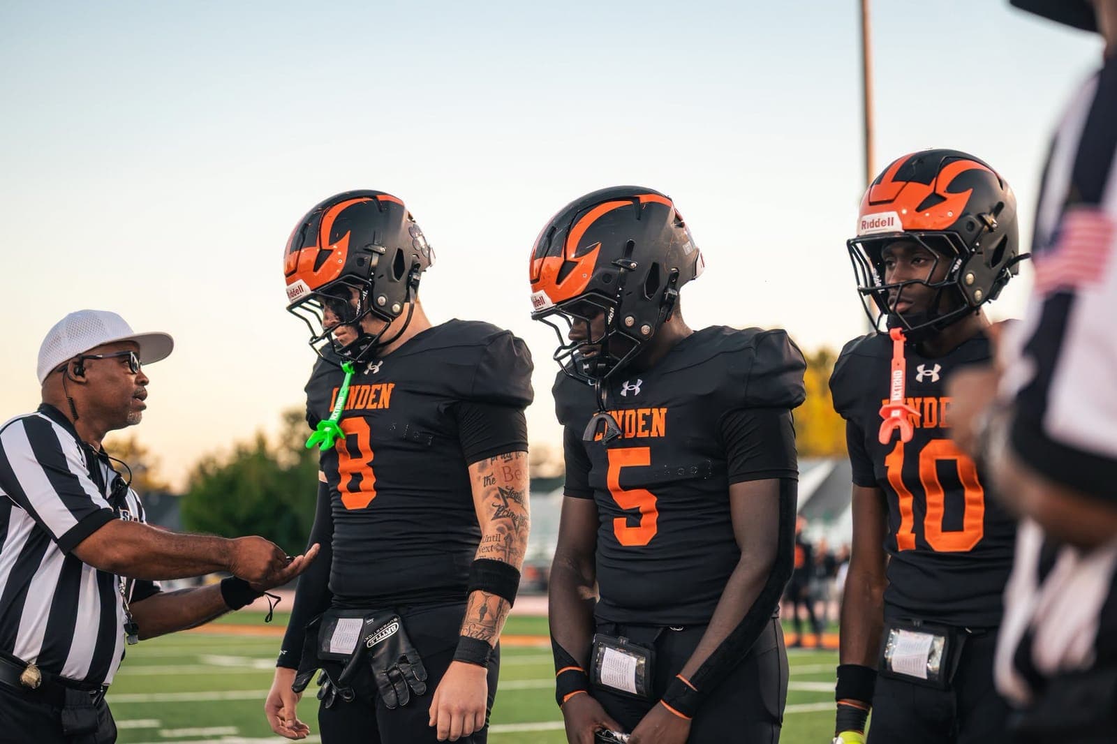 Linden players prepare for kickoff during the Tigers’ home opener.